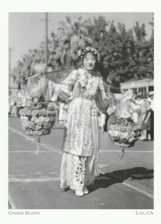 1936 postcard showing a "Chinese Maiden" in the streets of Lodi.