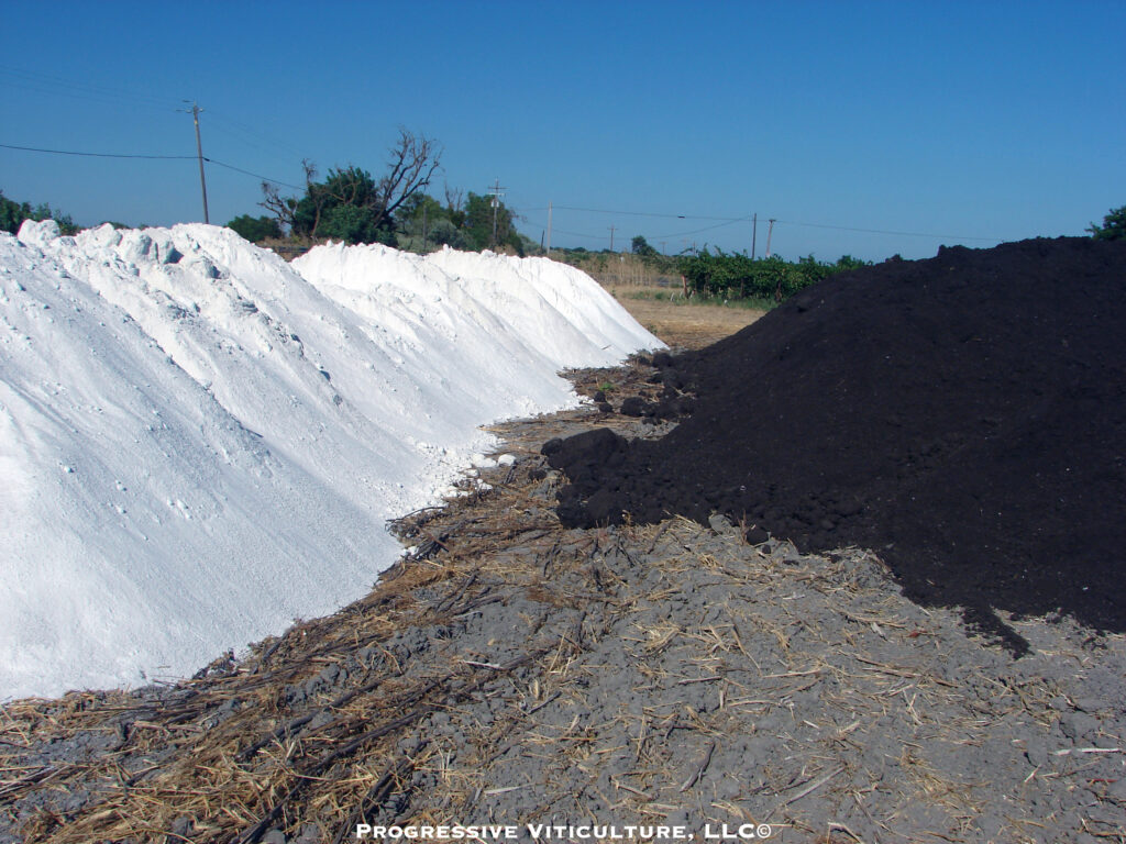 Fig. 1. Two soil amendments commonly applied before deep tillage: gypsum (white) on the left and compost (dark brown) on the right. (Photo Source: Progressive Viticulture, LLC©)