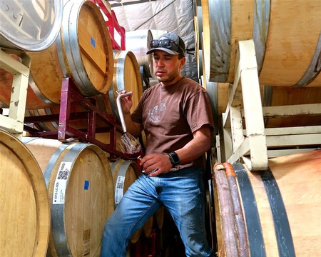 Anaya Vineyards' Gerardo Espinosa sampling Nebbiolo in his Lodi Crush winery.